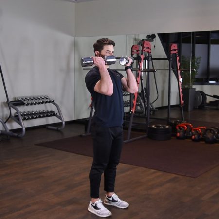 Arnoldki - Wyciskanie hantli nad głowę z rotacją stojąc Arnoldki - Wyciskanie hantli nad głowę z rotacją stojąc