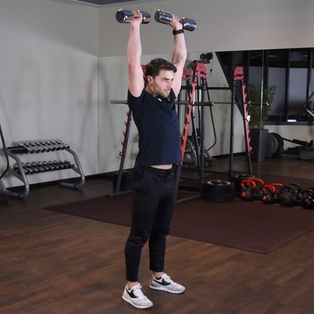 Wyciskanie hantli nad głowę stojąc Wyciskanie hantli nad głowę stojąc