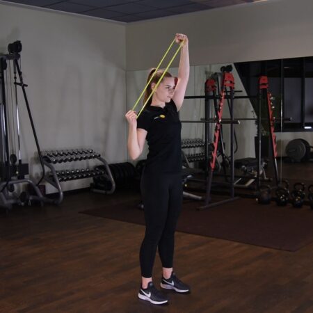 Ściąganie gumy mini band jednorącz za głowę w staniu just be fit