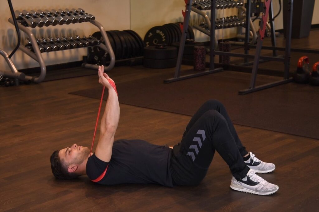 Flor press jednorącz z gumą mini-band-prostokąt Wyciskanie jednorącz gumy mini band leżąc na ziemi